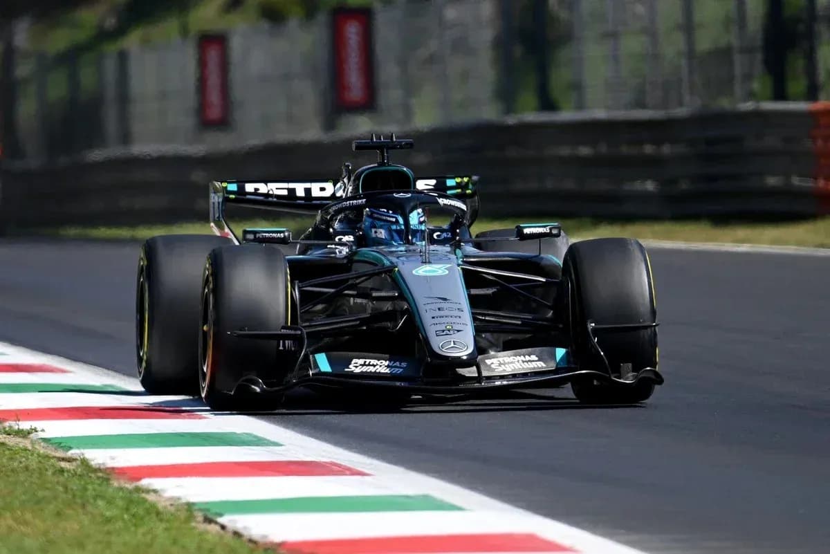Mercedes Formula 1 car navigating a track corner Mercedes Formula 1 car navigating a track corner