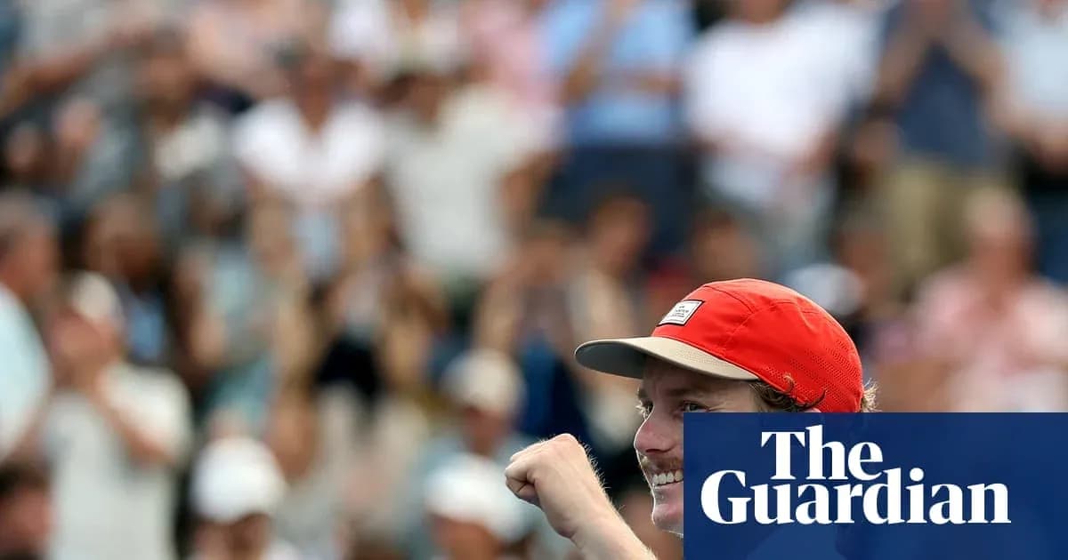 Player celebrating with raised fist in crowd Player celebrating with raised fist in crowd
