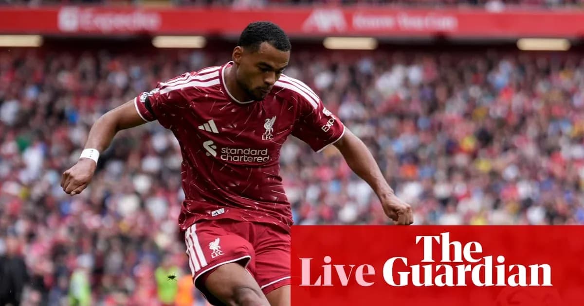 Liverpool player dribbling during a match Liverpool player dribbling during a match