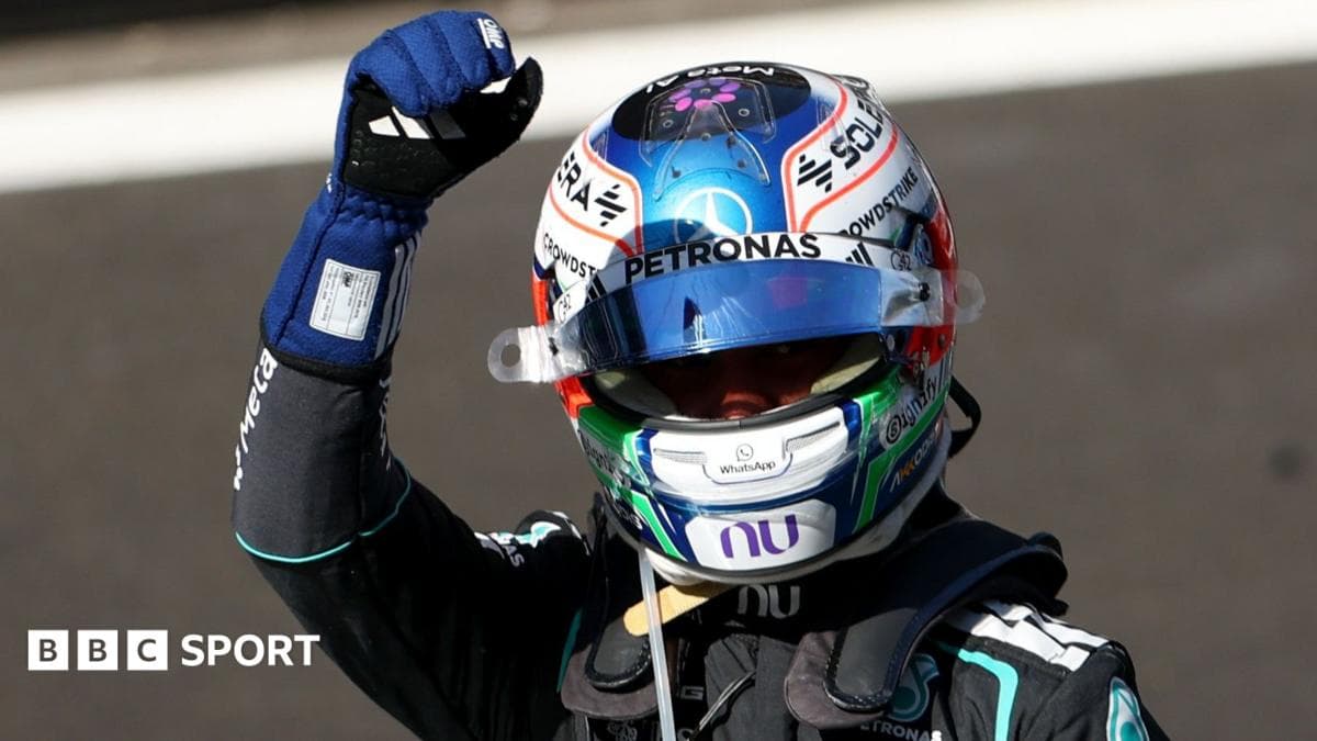 Racing driver celebrating with a raised fist Racing driver celebrating with a raised fist