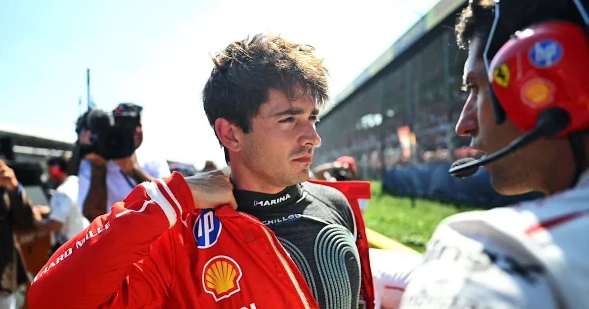 Driver adjusting his racing suit before the race Driver adjusting his racing suit before the race