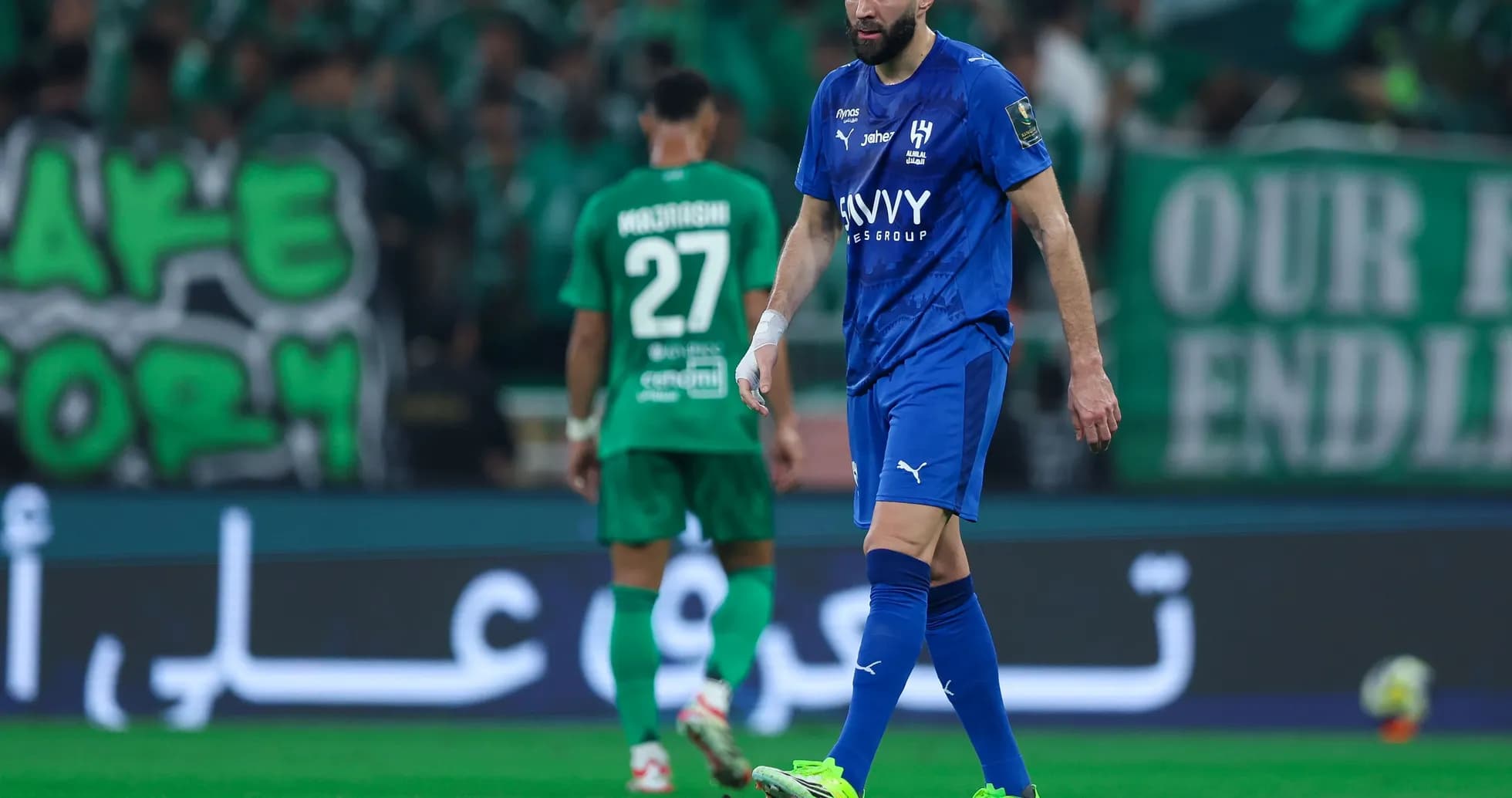 Player walking on field during football match Player walking on field during football match