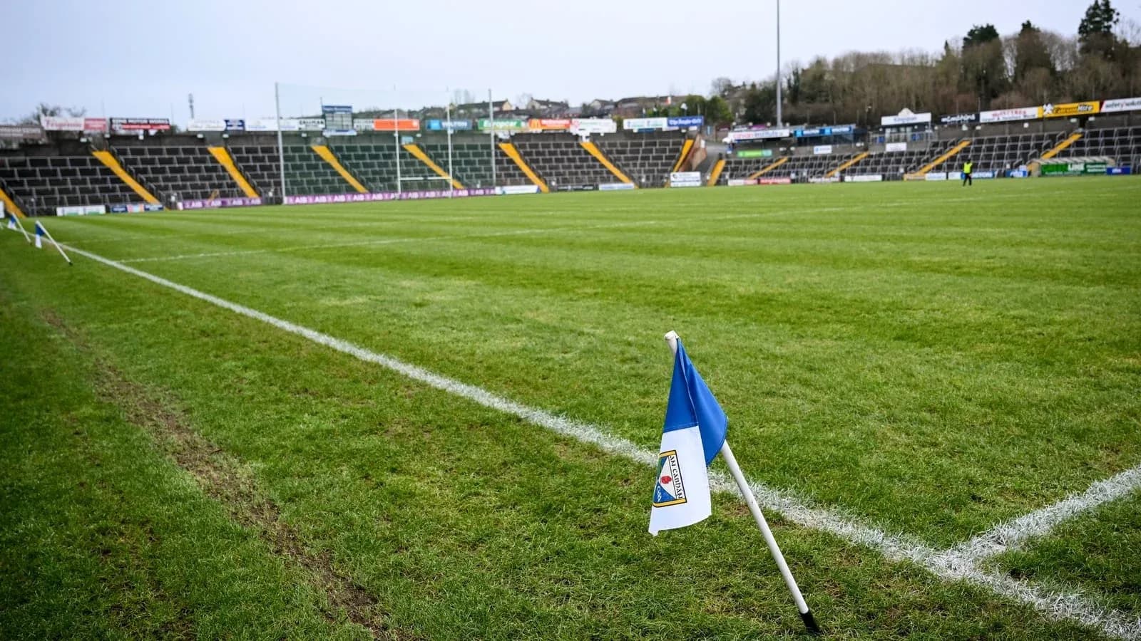 Corner flag at a rugby field with empty stands Corner flag at a rugby field with empty stands