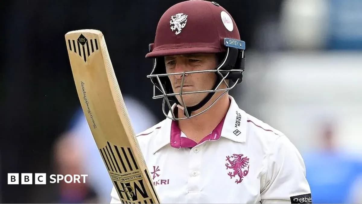 Cricketer from Somerset team holding a bat Cricketer from Somerset team holding a bat