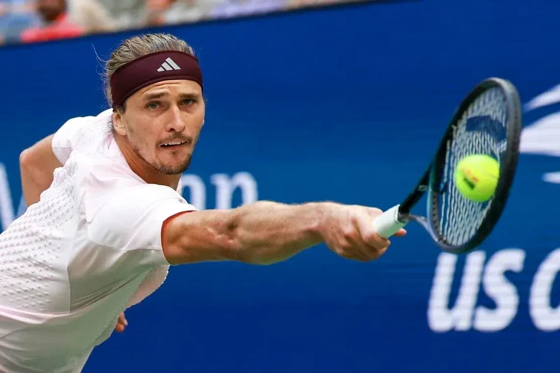 Player hitting a tennis ball during a match Player hitting a tennis ball during a match
