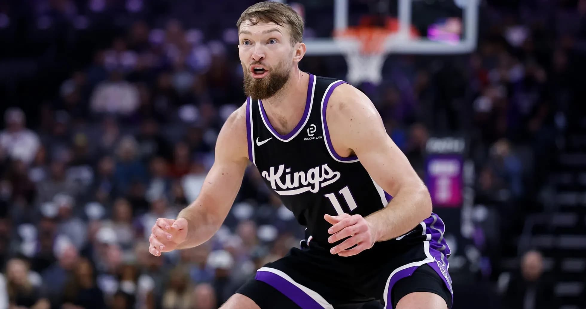 Player defending during a basketball game Player defending during a basketball game