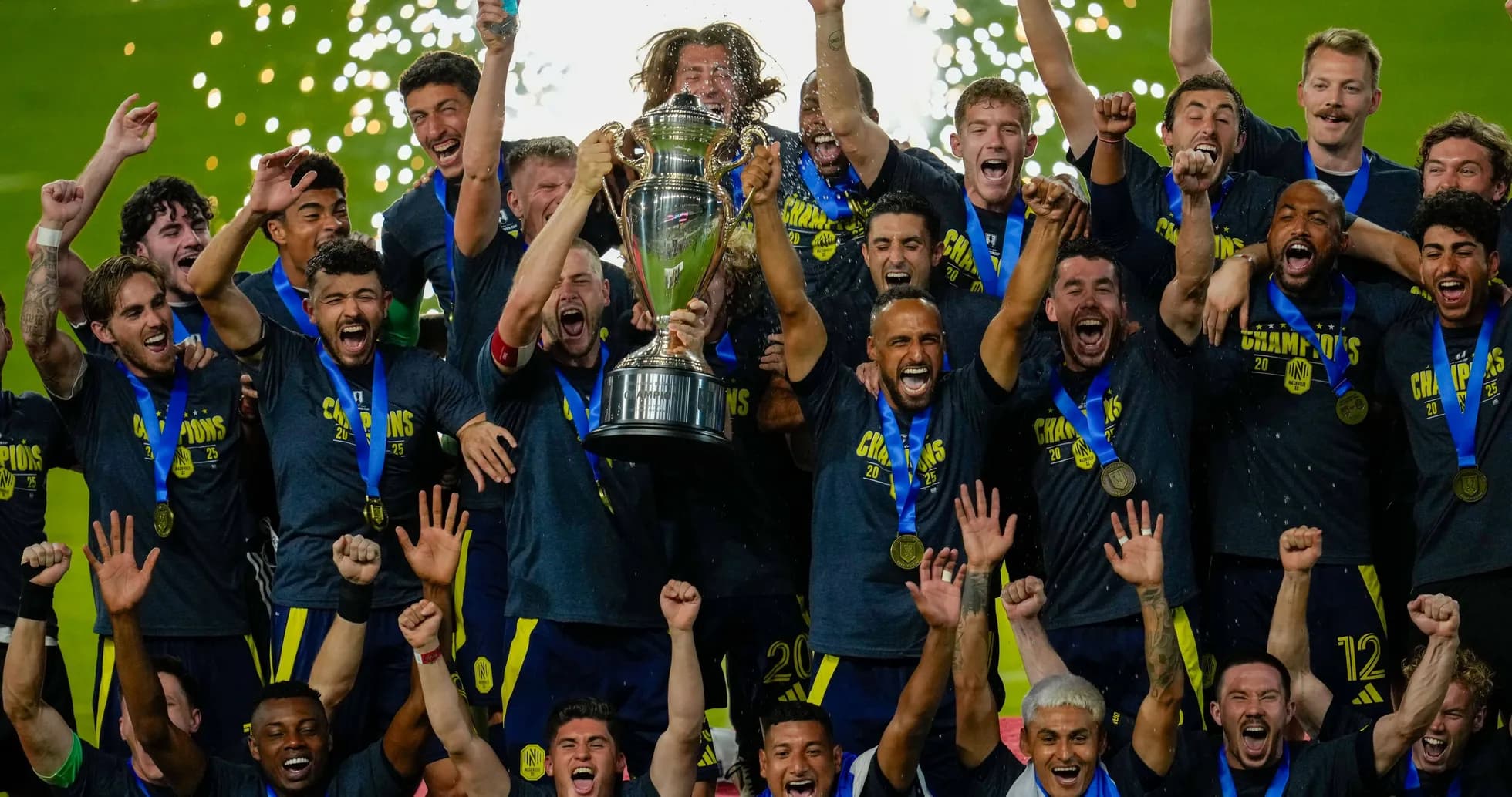 Team celebrating championship victory with trophy Team celebrating championship victory with trophy