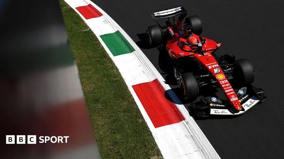 Ferrari F1 car navigating a corner on track Ferrari F1 car navigating a corner on track