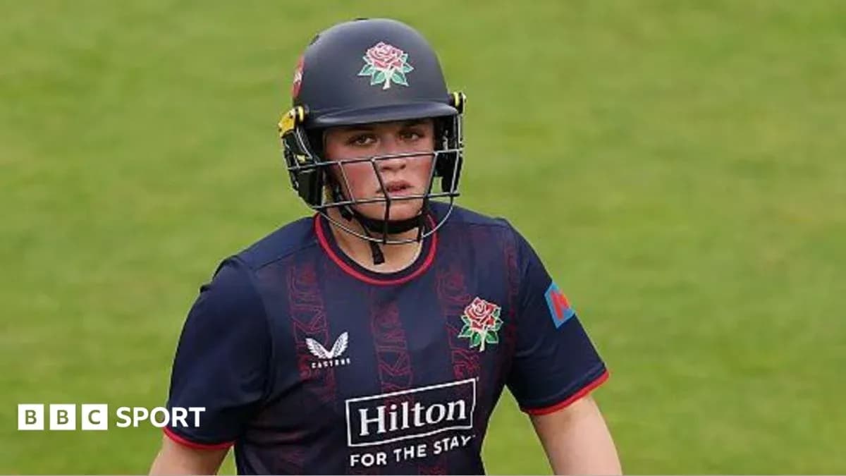Cricketer wearing helmet and team uniform on field Cricketer wearing helmet and team uniform on field