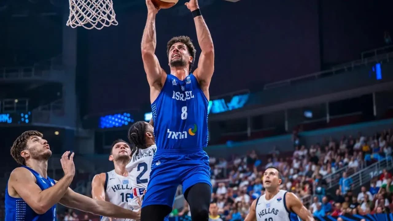 Player from Israel attempting a slam dunk Player from Israel attempting a slam dunk