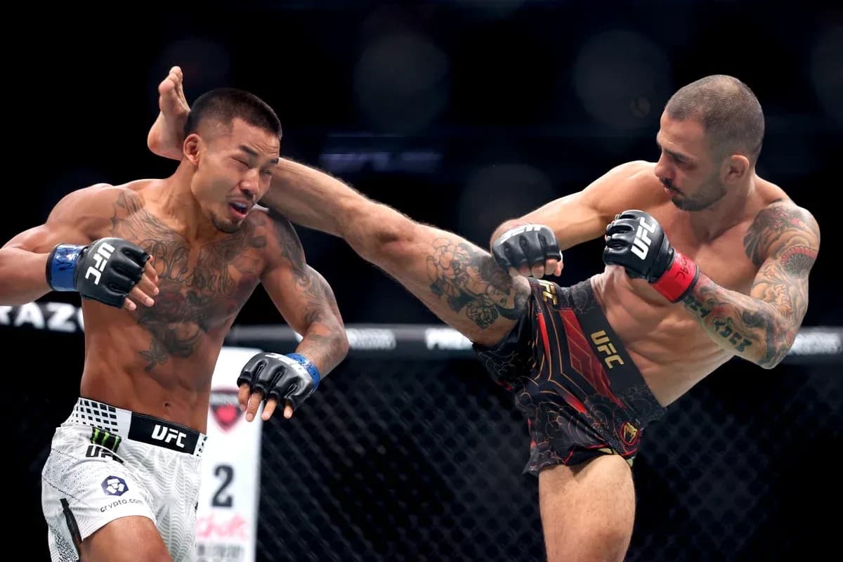 Two fighters engaging in a UFC match action Two fighters engaging in a UFC match action