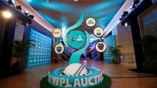 WPL auction display with team logos and decor WPL auction display with team logos and decor