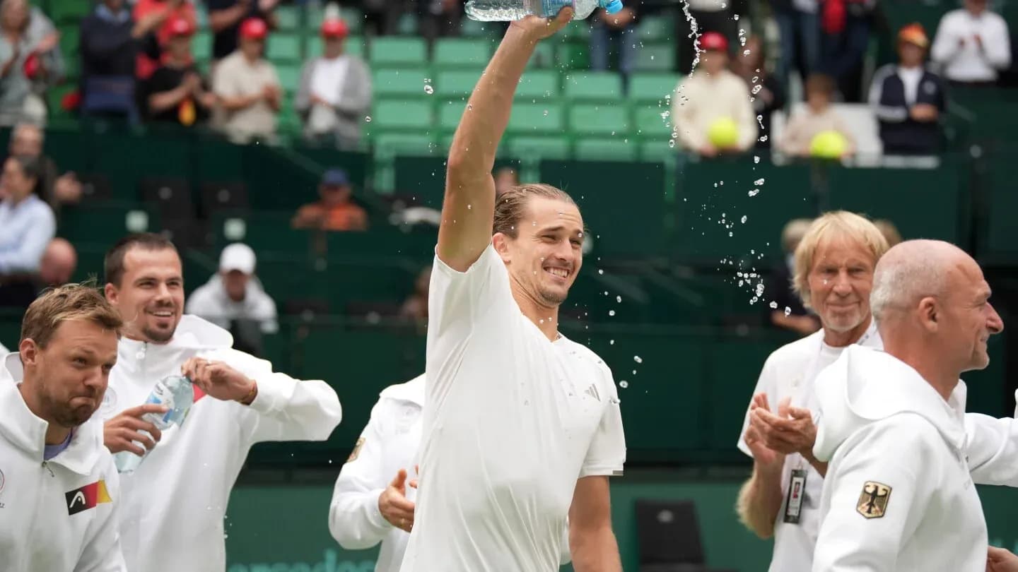 Player celebrating with teammates and water bottle Player celebrating with teammates and water bottle