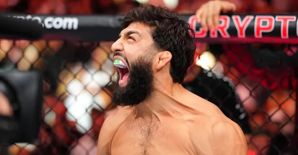 Fighter celebrating inside the octagon after match Fighter celebrating inside the octagon after match