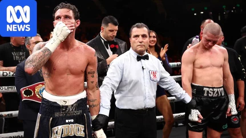 Boxers and referee in the ring after match Boxers and referee in the ring after match