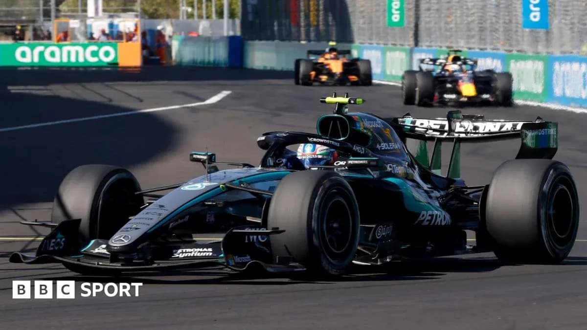 Mercedes Formula 1 car racing on track Mercedes Formula 1 car racing on track