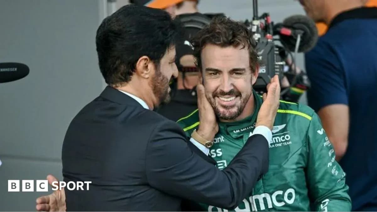 Two men interacting in a racing team setting Two men interacting in a racing team setting