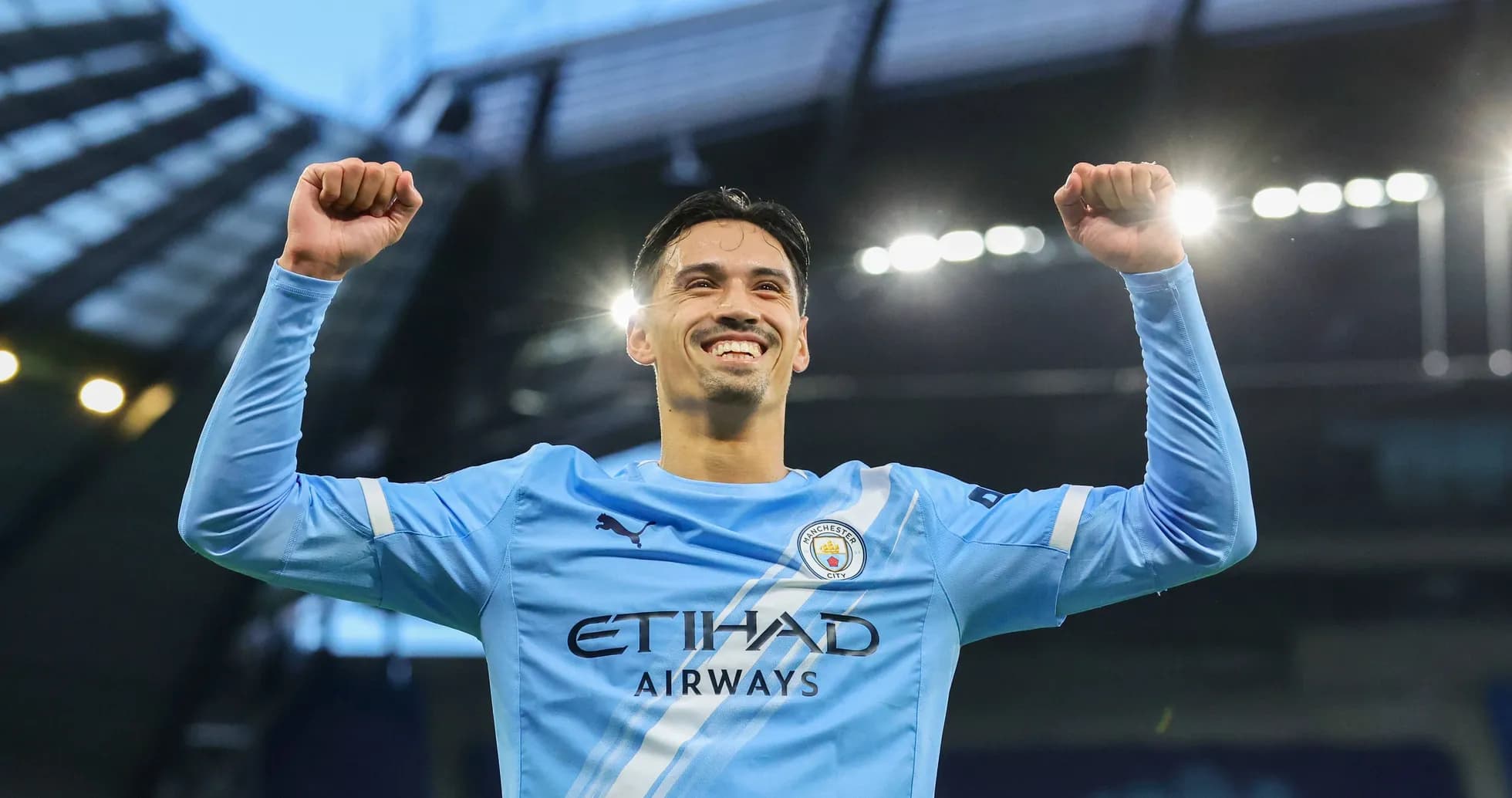Player celebrating victory with raised arms Player celebrating victory with raised arms
