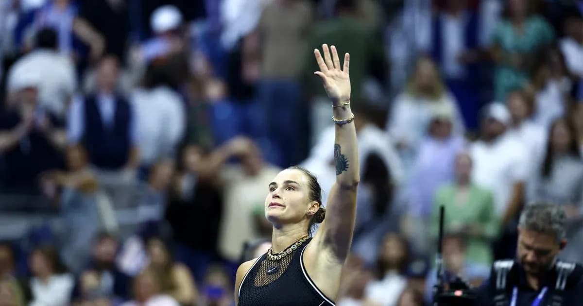 Tennis player waving to crowd after match Tennis player waving to crowd after match