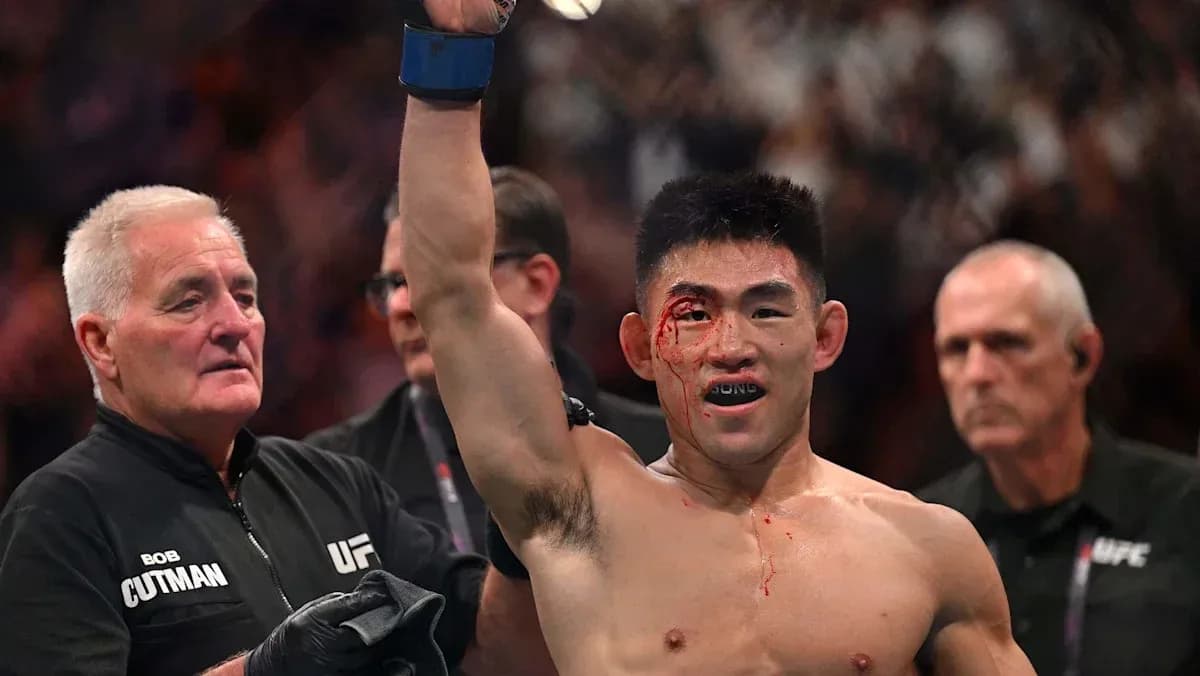 Fighter celebrating victory with blood on face Fighter celebrating victory with blood on face