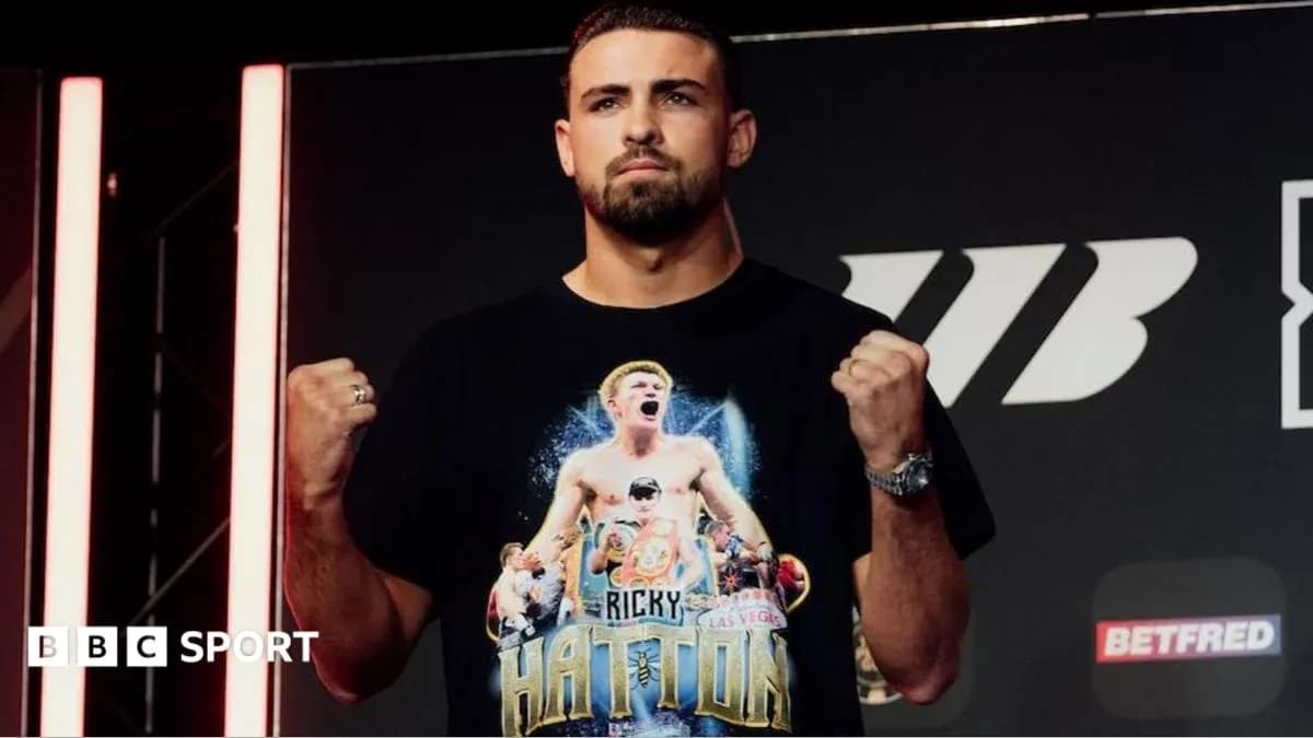 Boxer posing with clenched fists at press event Boxer posing with clenched fists at press event