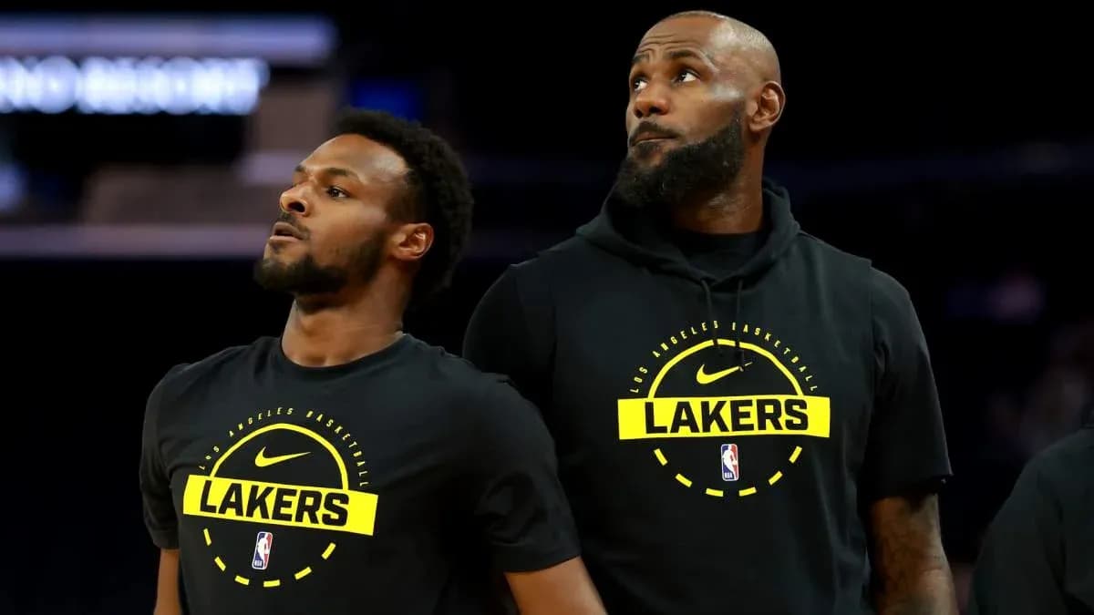 Two Los Angeles Lakers players in warm-up jerseys Two Los Angeles Lakers players in warm-up jerseys