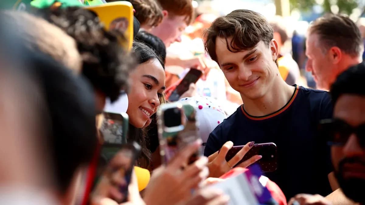 Fans taking selfies with each other at event Fans taking selfies with each other at event