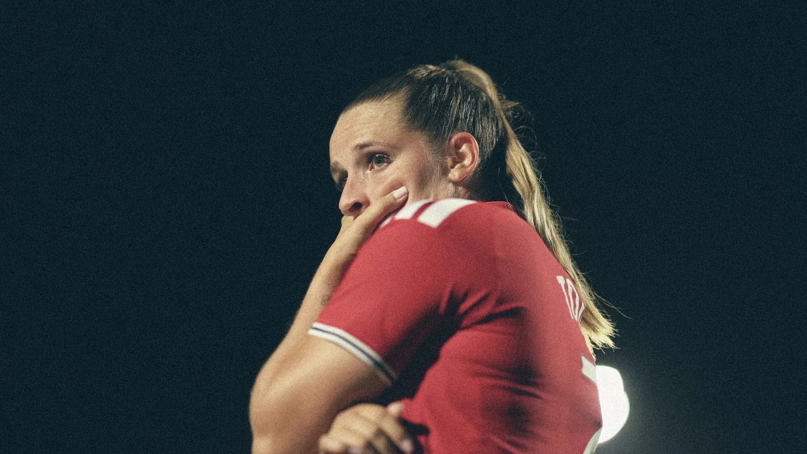 Player in red jersey during night match Player in red jersey during night match