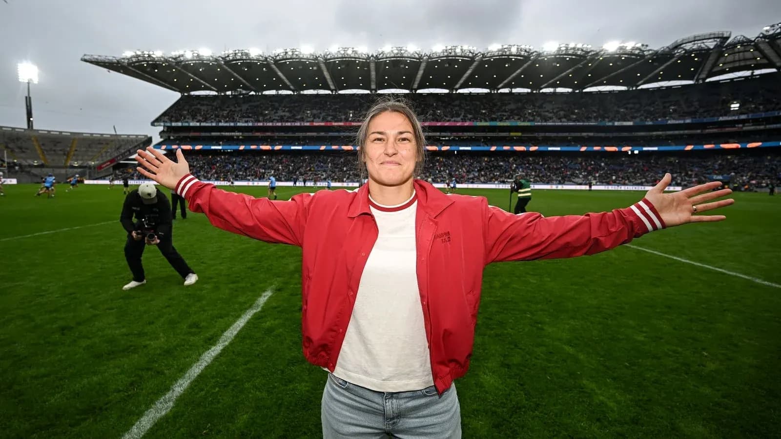 Female athlete celebrating on the pitch at stadium Female athlete celebrating on the pitch at stadium