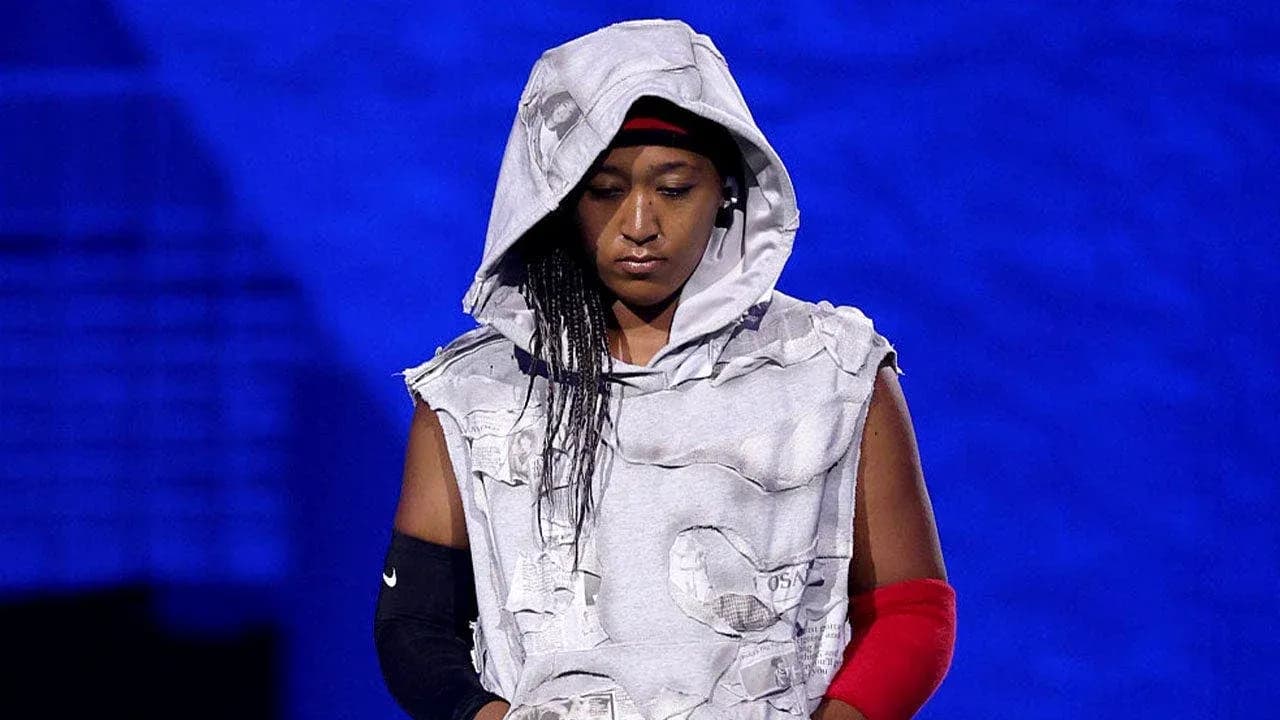Athlete wearing unique outfit on stage Athlete wearing unique outfit on stage